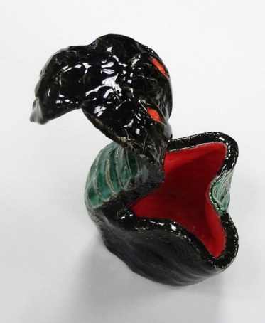 Create a cup or bowl using coil-building, then attach animal features. Functional and unique!