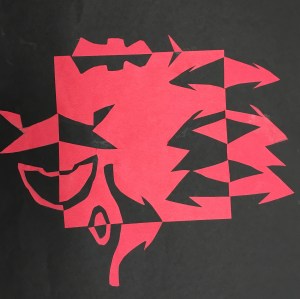 Students use symmetry to create a notan with paper and glue sticks.