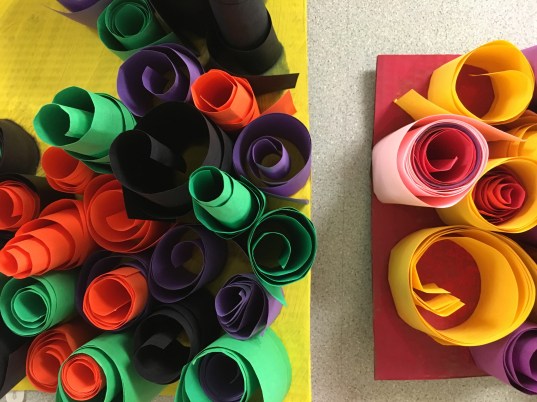 Students create abstract sculptures using paper and art paste.