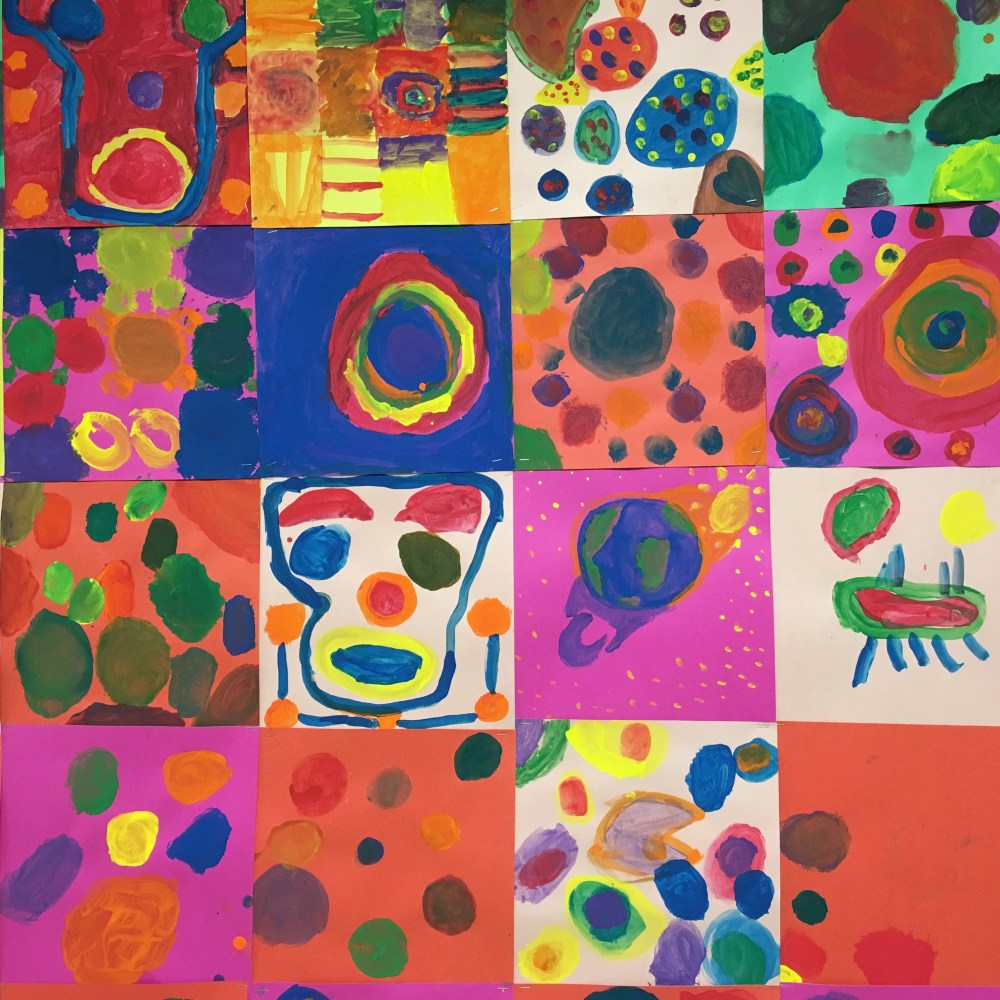 Elementary students paint artwork inspired by Kandinsky.