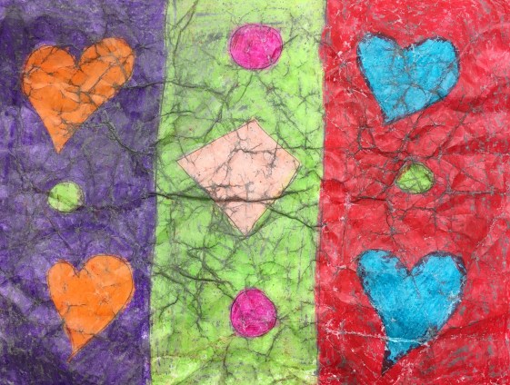 Students create wax resist artwork using crayons and india ink.