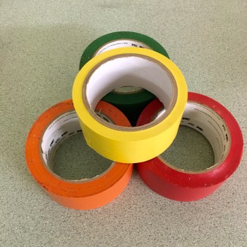 Color-coded seats provide a flexible way to assign jobs in art class.